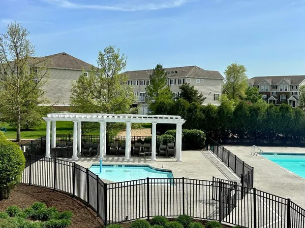 a balcony with view of an outdoor space