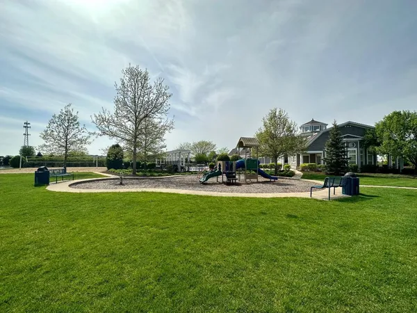 a swimming pool with outdoor seating and yard