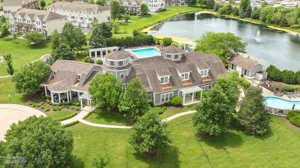 an aerial view of a house with outdoor space lake view and lake view