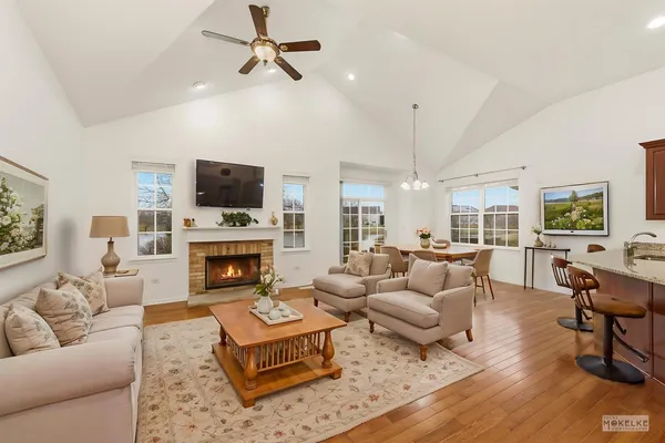 a living room with furniture fireplace and a flat screen tv