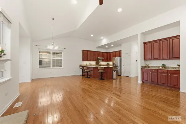 a view of kitchen with furniture and wooden floor