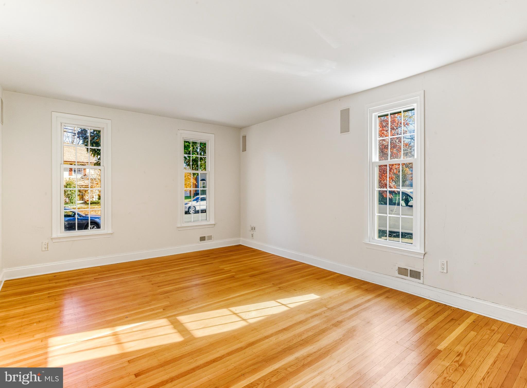 1102 Barnesdale Road West Deptford, NJ 08096 - Photo 13 of 32 a view of an empty room with wooden floor and a window
