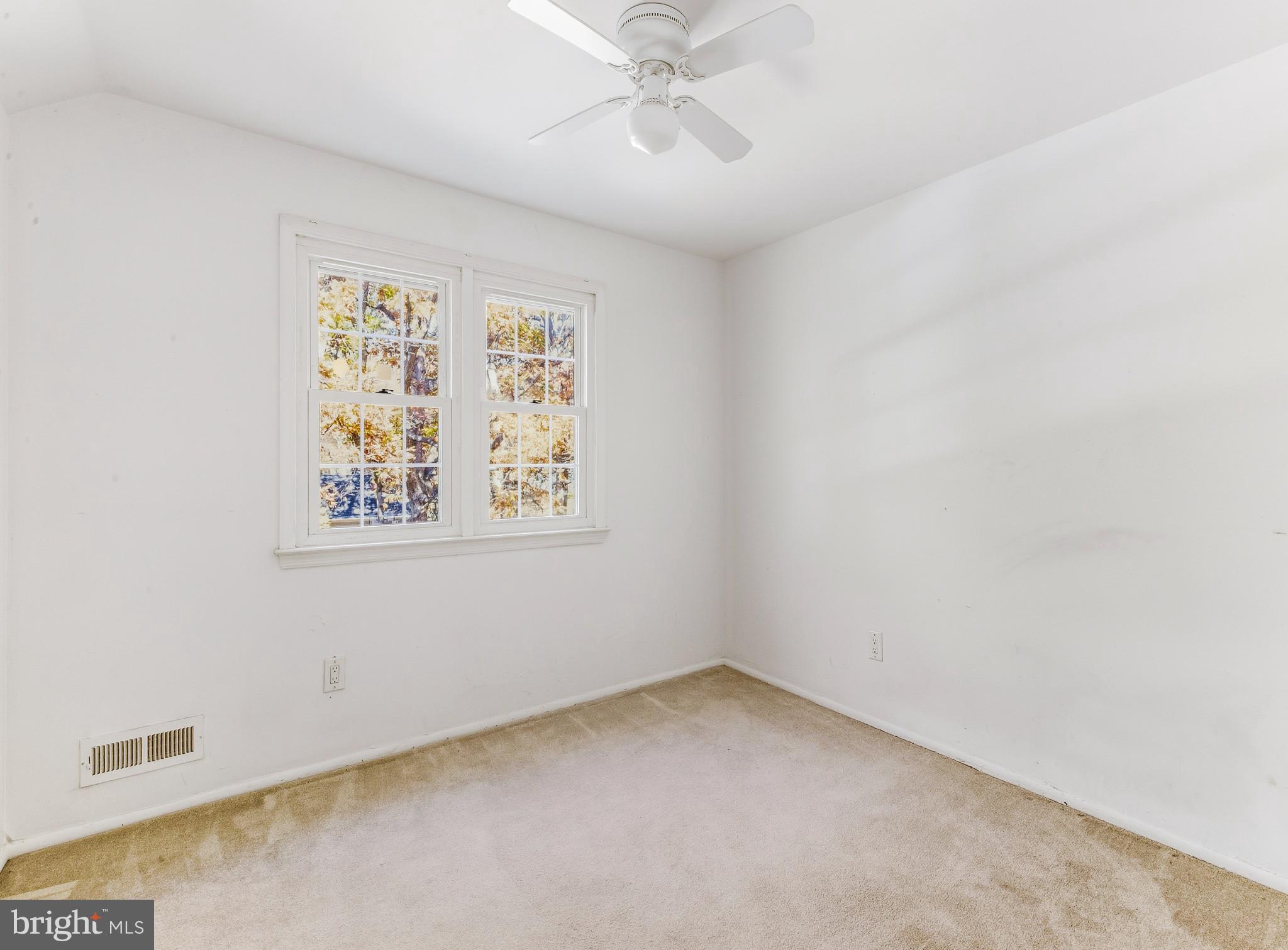 1102 Barnesdale Road West Deptford, NJ 08096 - Photo 18 of 32 an empty room with a window and a ceiling fan