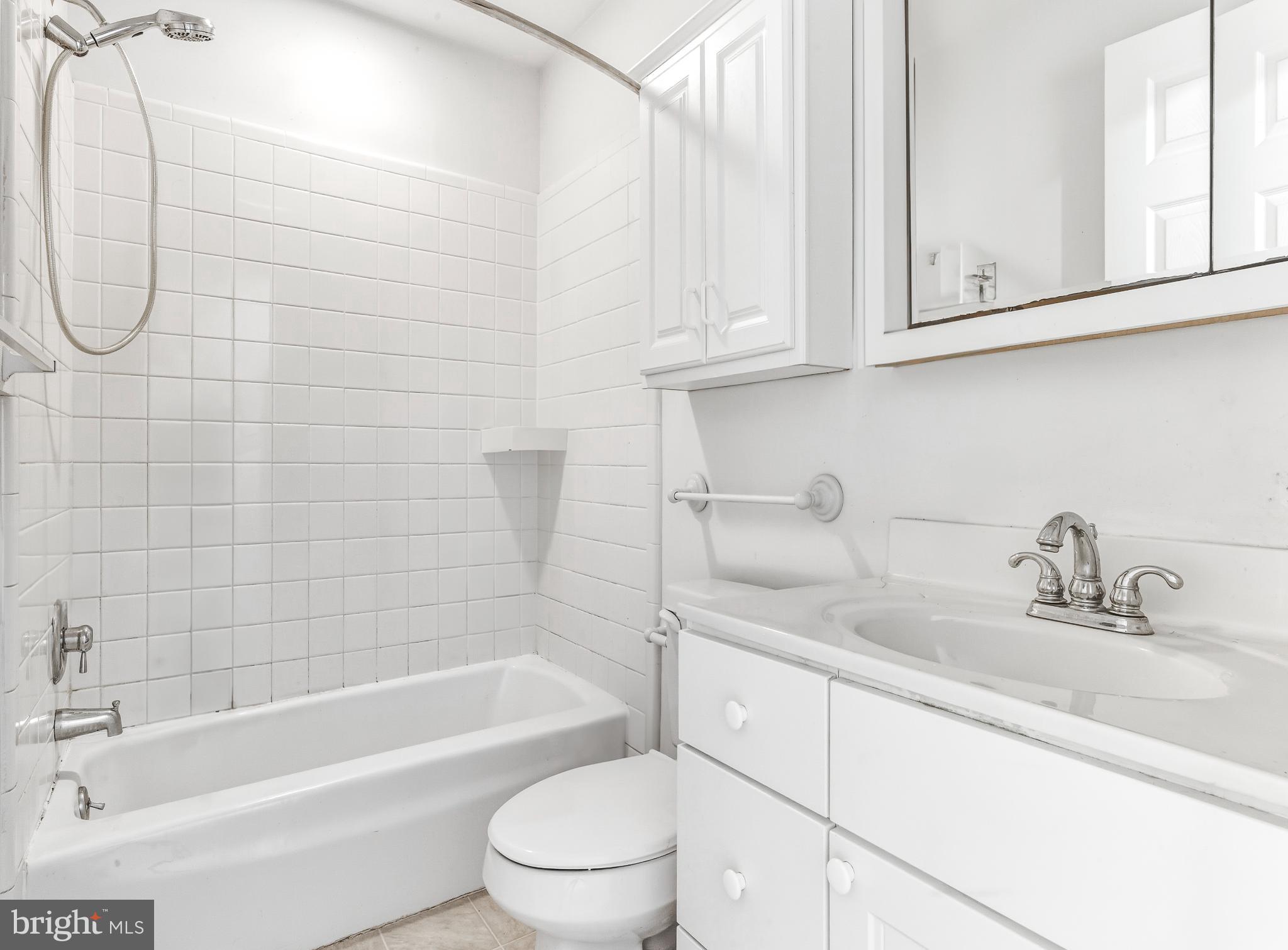 1102 Barnesdale Road West Deptford, NJ 08096 - Photo 20 of 32 a bathroom with a sink a toilet and bathtub
