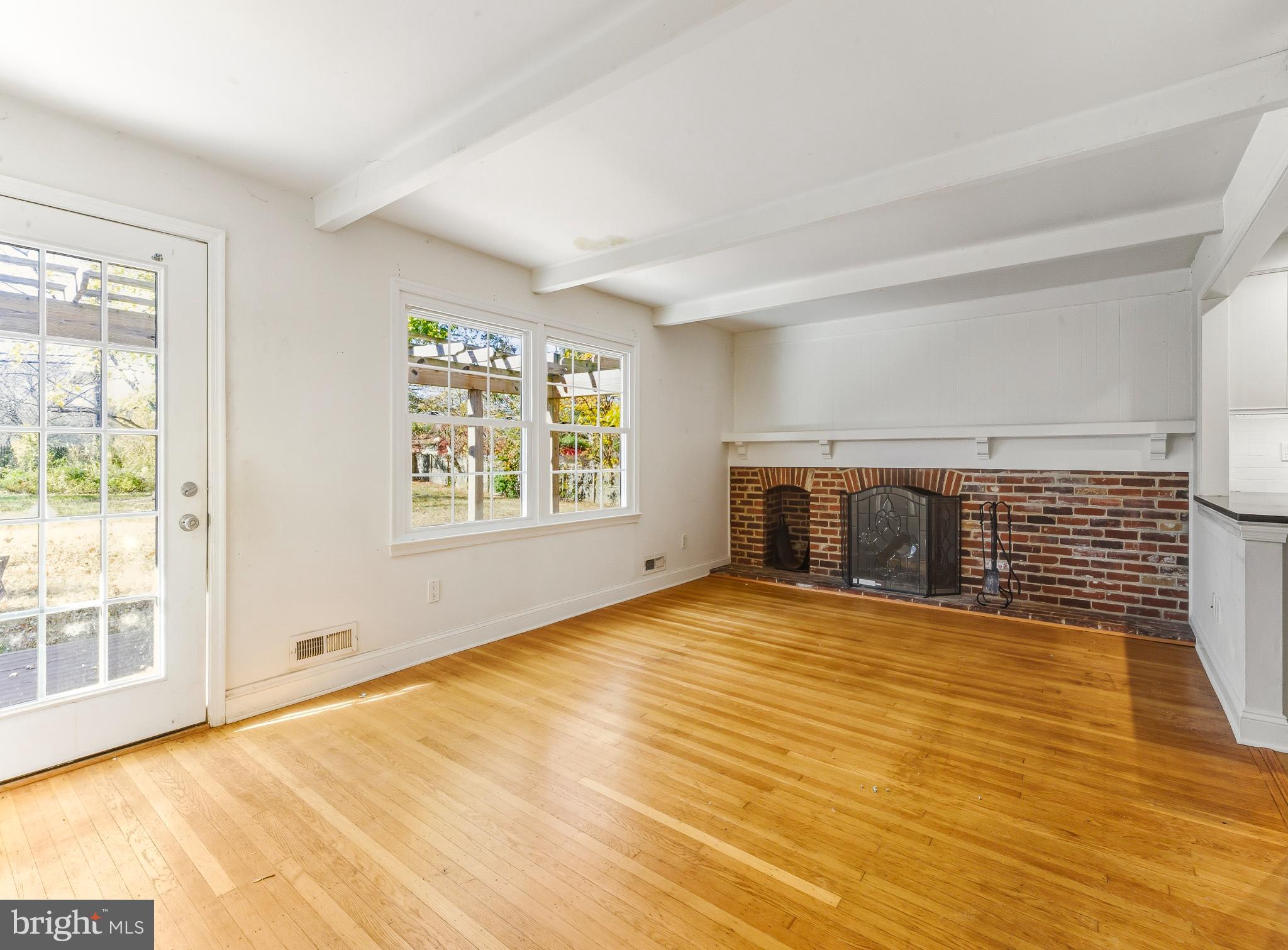 1102 Barnesdale Road West Deptford, NJ 08096 - Photo 10 of 32 a view of empty room with wooden floor and fireplace
