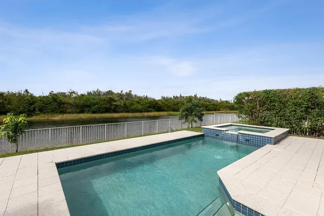 a view of a swimming pool with a lake view