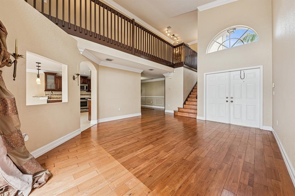 2755 Southwest 165th Avenue Miramar, FL 33027 - Photo 3 of 18 a view of an entryway with wooden floor