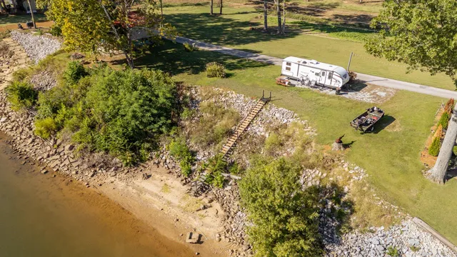 a aerial view of a house with a yard