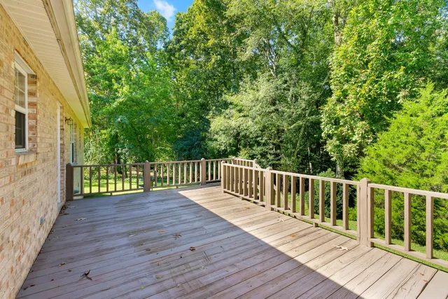 a balcony with wooden floor