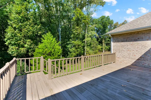 a view of a balcony with wooden floor