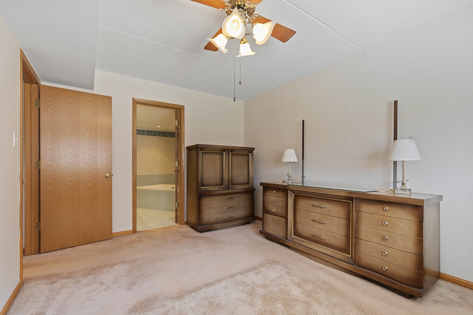 18136 Rita Road, Unit 1C Tinley Park, IL 60477 - Photo 13 of 26 a view of a kitchen with a sink cabinets and a refrigerator