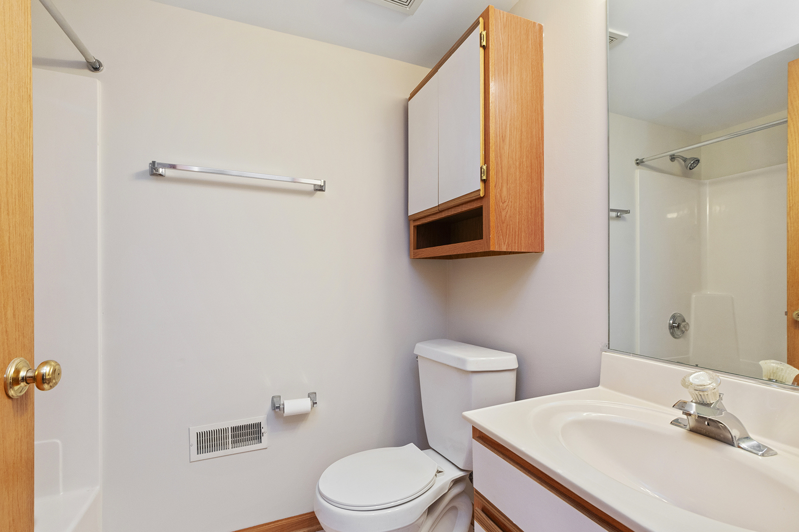 18136 Rita Road, Unit 1C Tinley Park, IL 60477 - Photo 16 of 26 a bathroom with a sink toilet and shower