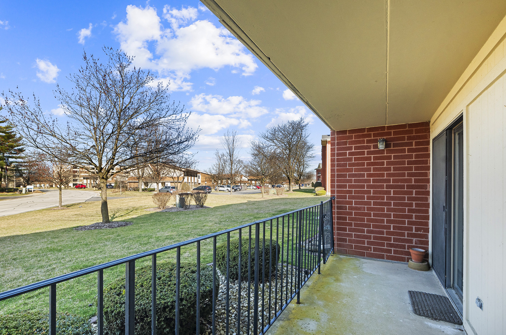 18136 Rita Road, Unit 1C Tinley Park, IL 60477 - Photo 18 of 26 a view of a porch with a yard