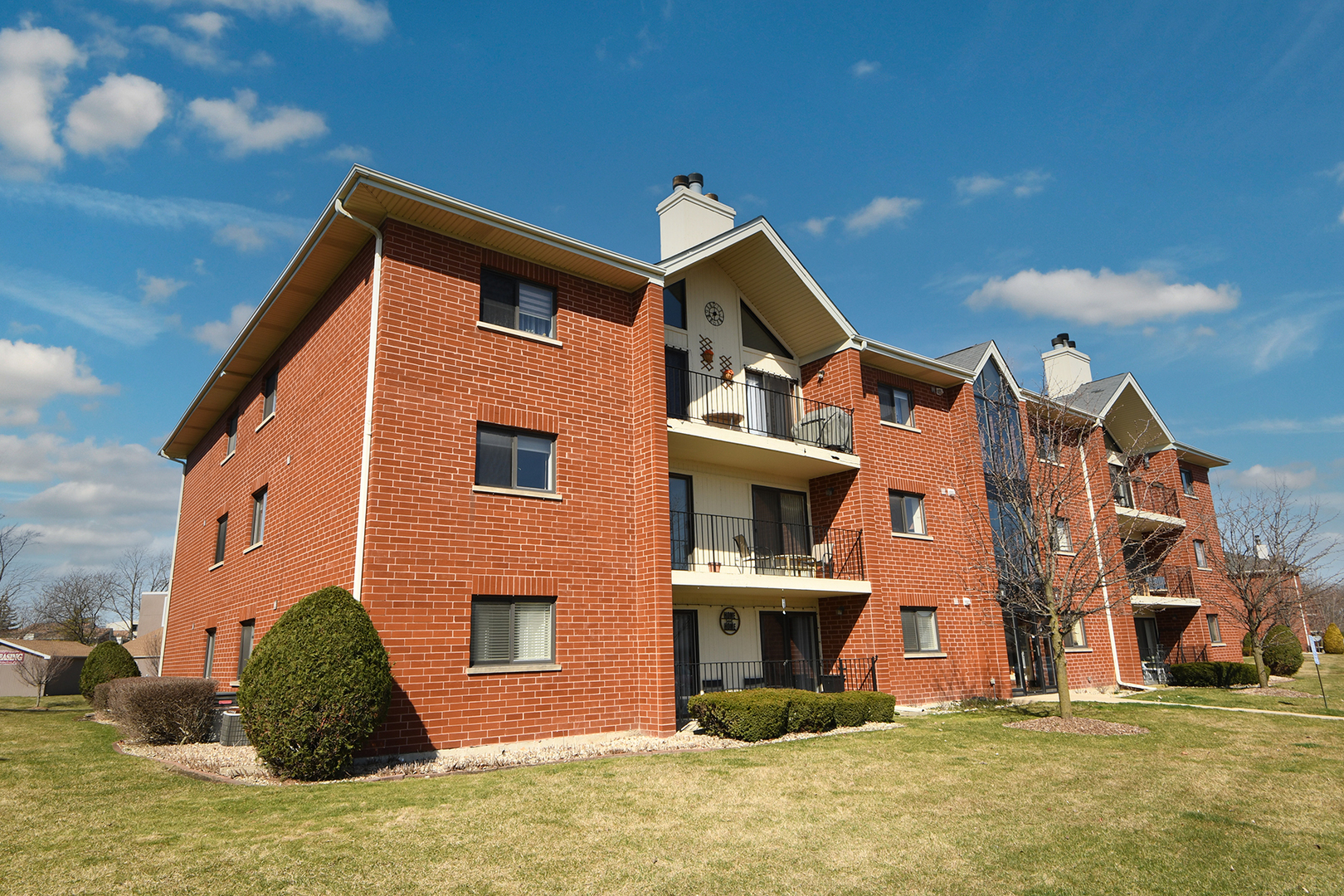18136 Rita Road, Unit 1C Tinley Park, IL 60477 - Photo 2 of 26 a front view of a house with a yard