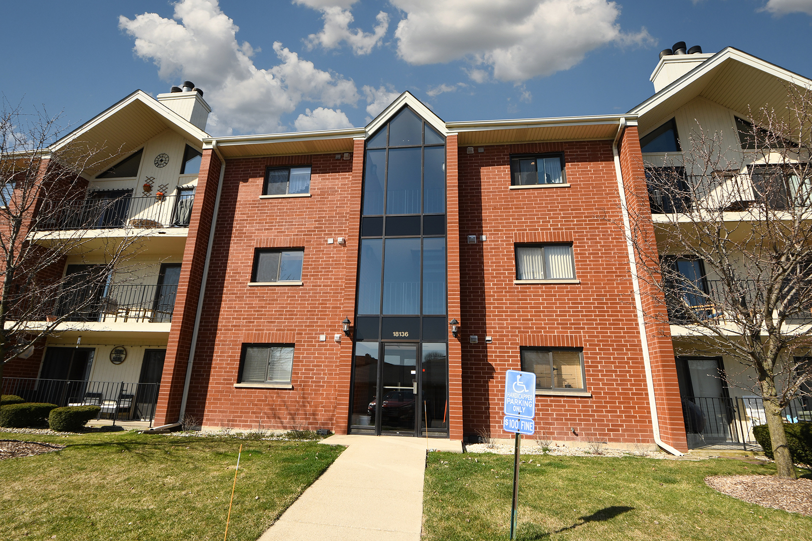 18136 Rita Road, Unit 1C Tinley Park, IL 60477 - Photo 25 of 26 a front view of a house with garden