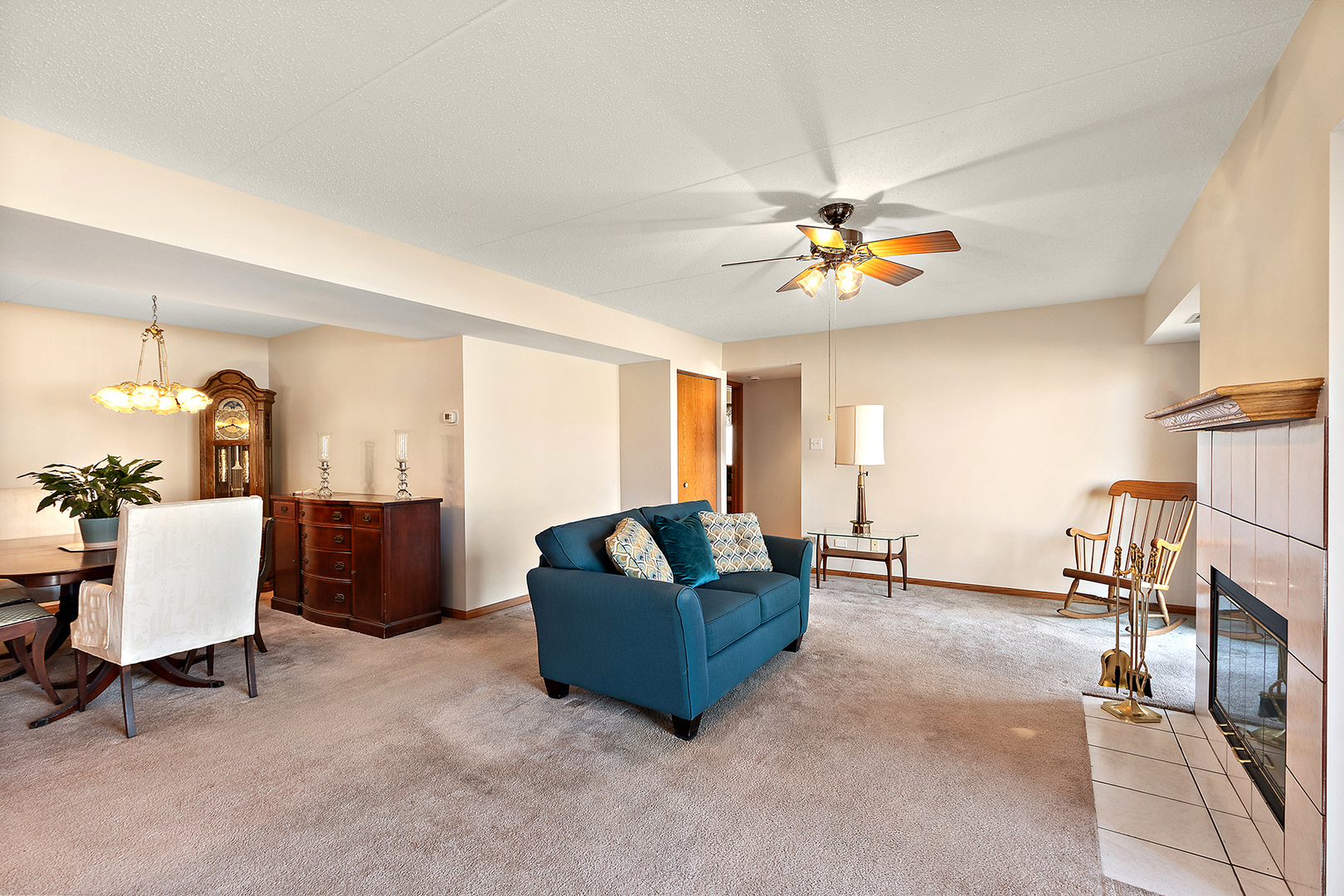 18136 Rita Road, Unit 1C Tinley Park, IL 60477 - Photo 7 of 26 a living room with furniture and a chandelier