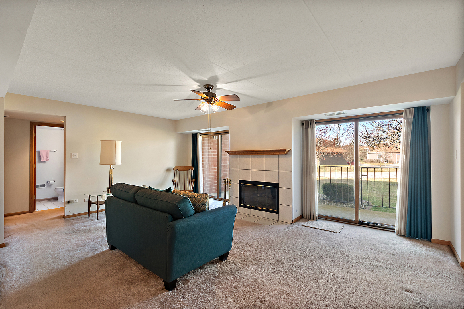 18136 Rita Road, Unit 1C Tinley Park, IL 60477 - Photo 9 of 26 a living room with furniture and a fireplace