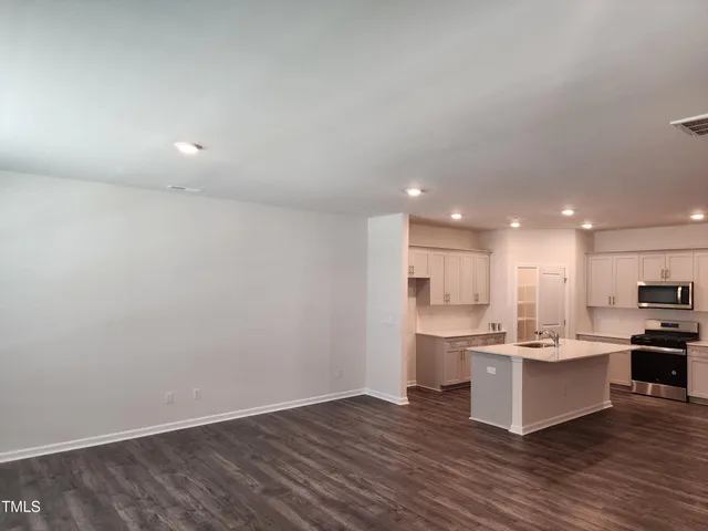 a view of kitchen with wooden floor