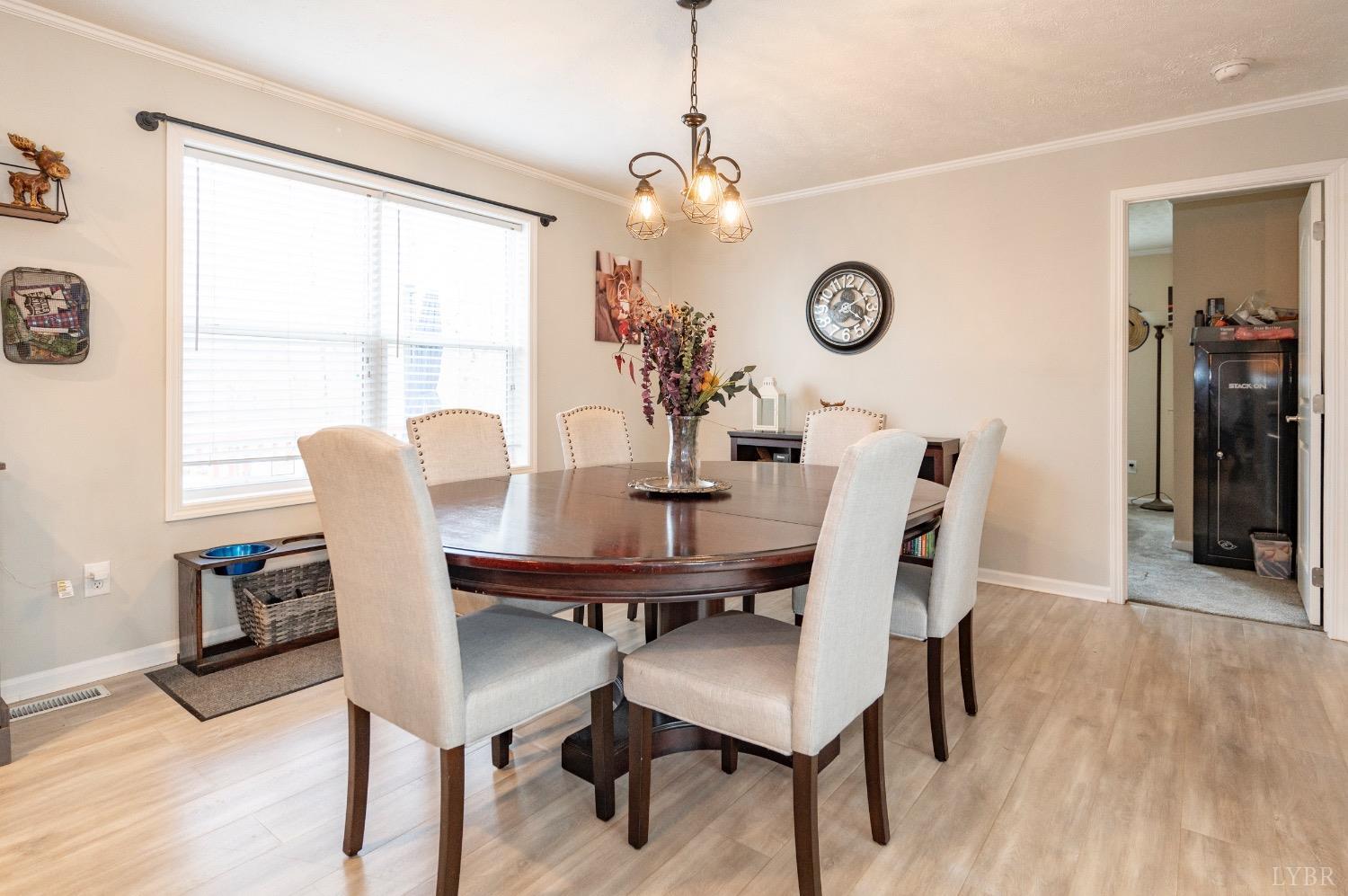563 Evington Road Evington, VA 24550 - Photo 12 of 17 a view of a dining room with furniture window and wooden floor
