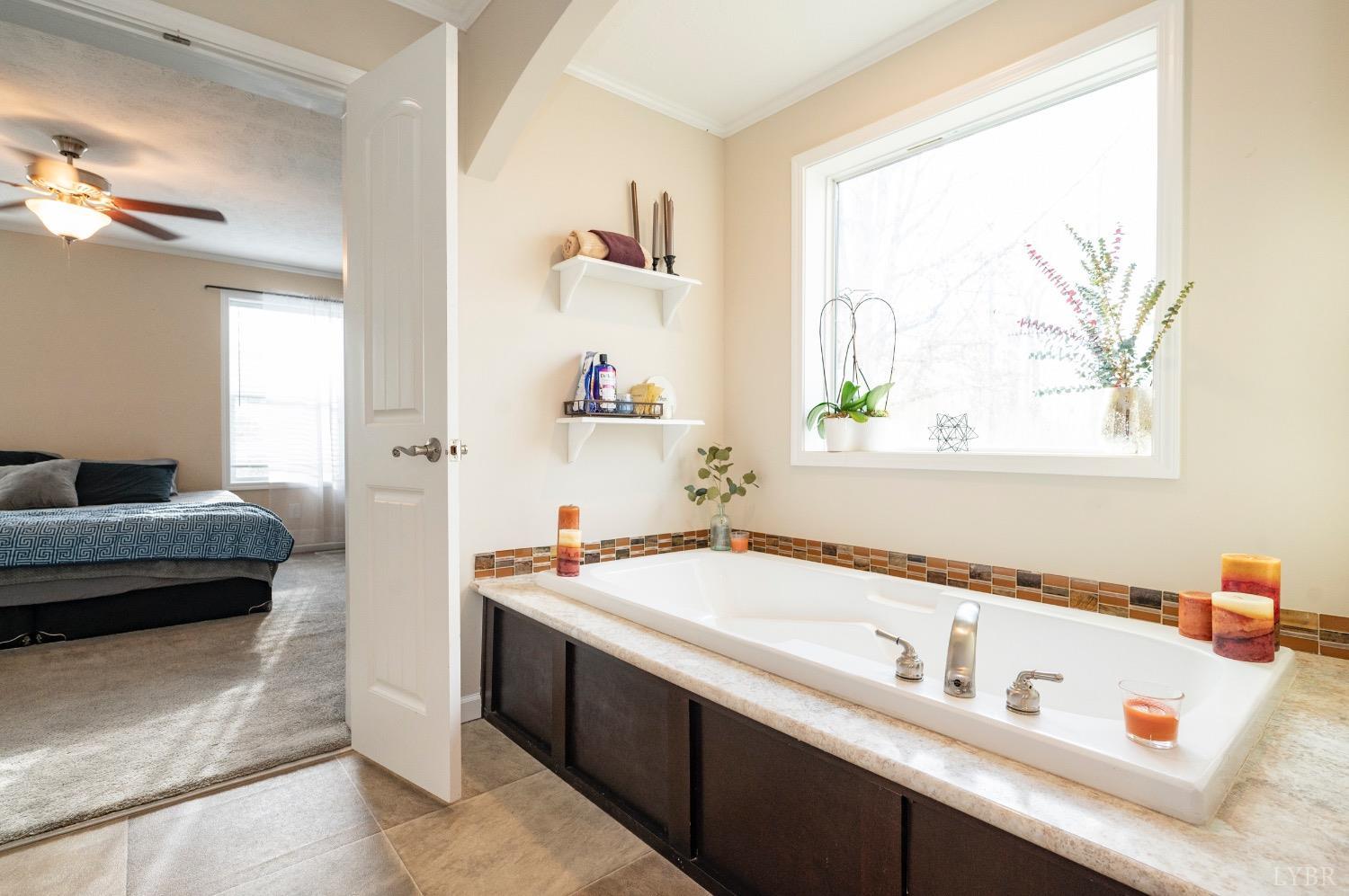 563 Evington Road Evington, VA 24550 - Photo 17 of 17 a bath room with a sink and a window
