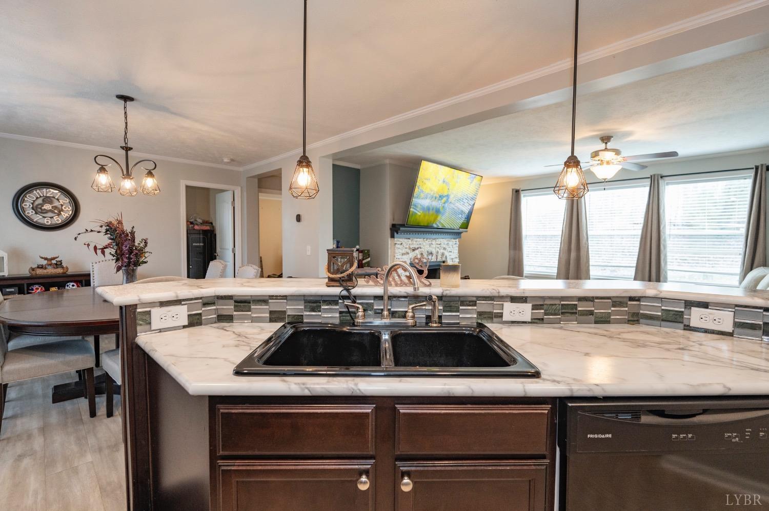 563 Evington Road Evington, VA 24550 - Photo 10 of 17 a kitchen with a sink a stove and a table