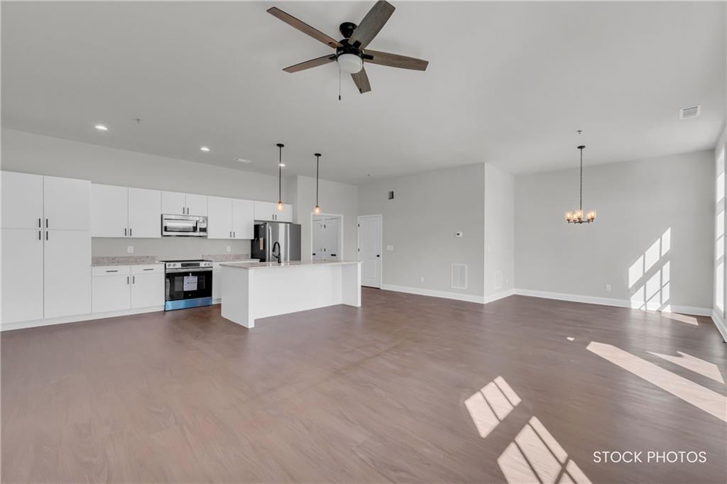 1038 Homestead Way Street Dacula, GA 30019 - Photo 6 of 36 a view of kitchen with furniture and window