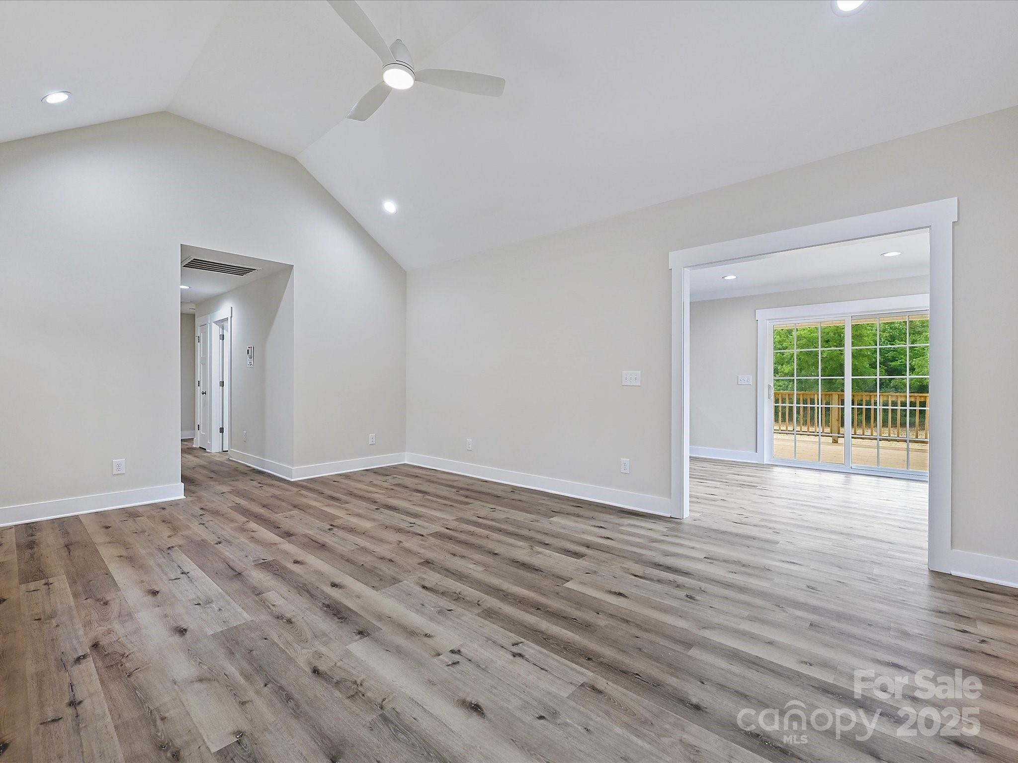 254 Old Pinckney Road York, SC 29745 - Photo 12 of 26 a view of an empty room with wooden floor and a window
