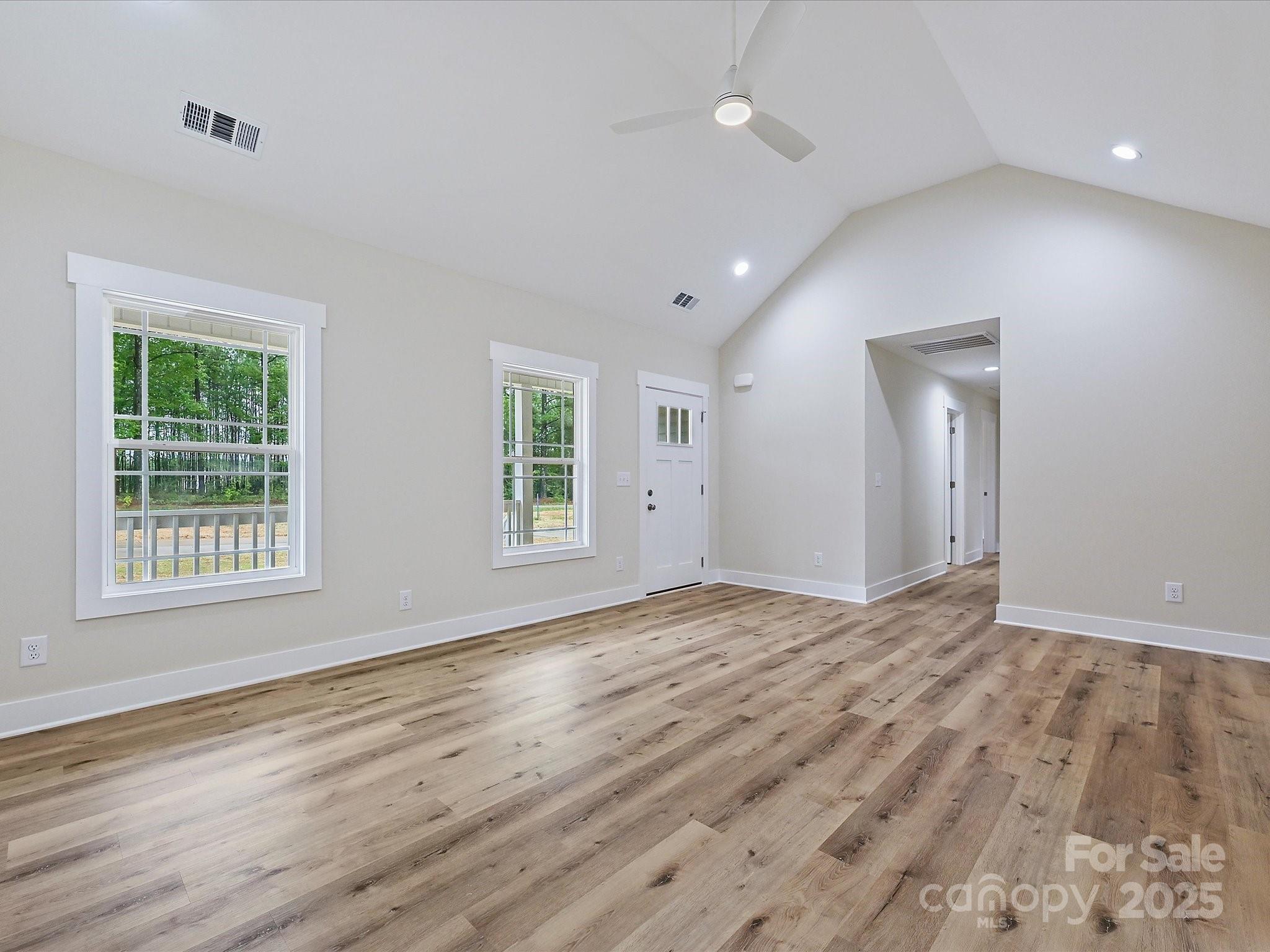 254 Old Pinckney Road York, SC 29745 - Photo 13 of 26 a view of an empty room with wooden floor and a window