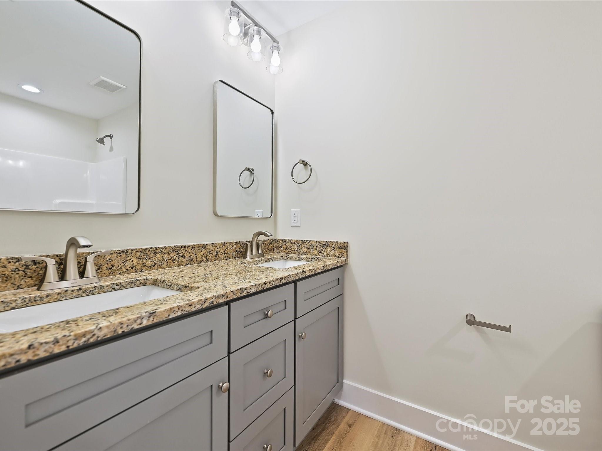 254 Old Pinckney Road York, SC 29745 - Photo 17 of 26 a bathroom with a granite countertop sink and a mirror