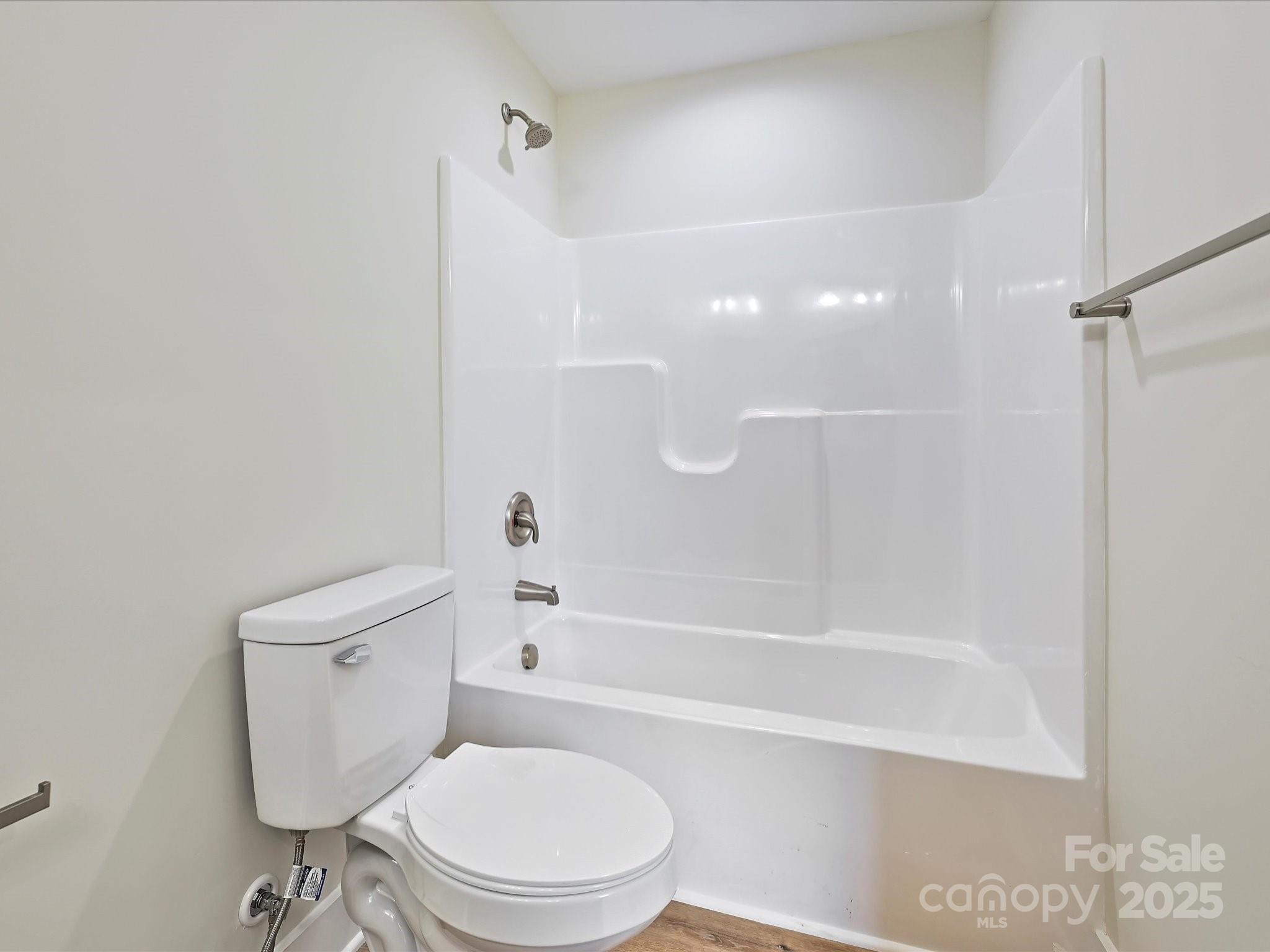 254 Old Pinckney Road York, SC 29745 - Photo 18 of 26 a white toilet and tub sitting next to a bathroom sink