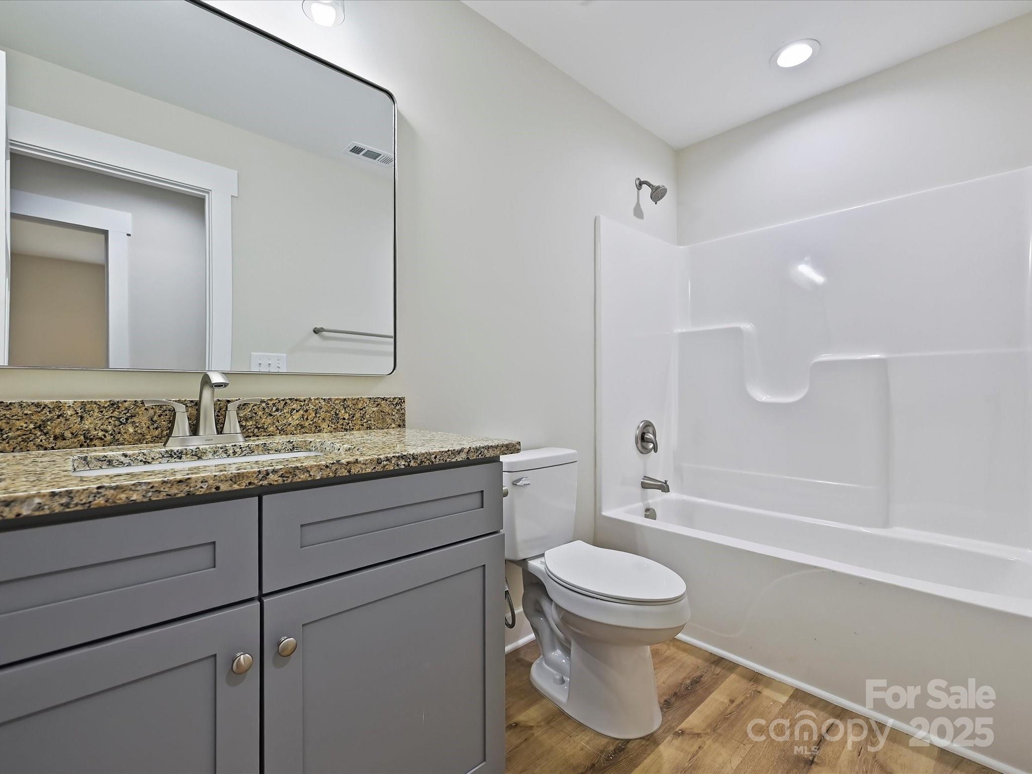 254 Old Pinckney Road York, SC 29745 - Photo 20 of 26 a bathroom with a granite countertop toilet sink and mirror