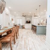 a large kitchen with a table and chairs in it