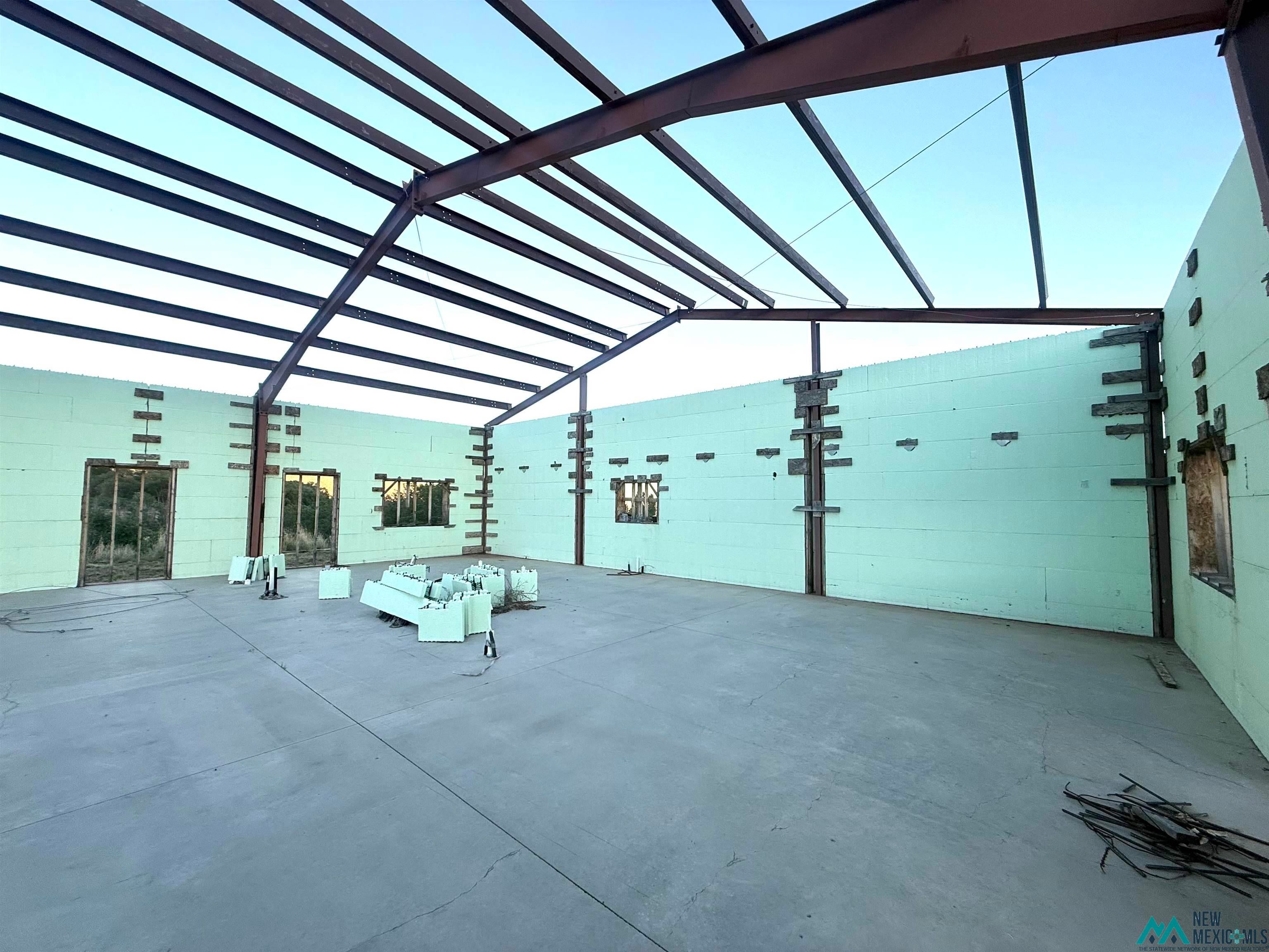 25 Linwood Road Raton, NM 87740 - Photo 7 of 41 Steel frame construction featuring an exposed beam ceiling, concrete slab flooring, and insulated concrete form walls