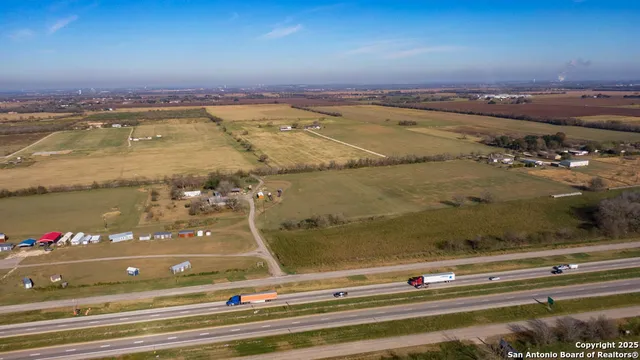 an aerial view of residential building with ocean view