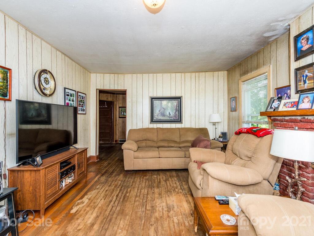 131 Frisby Road Marshall, NC 28753 - Photo 16 of 32 a living room with furniture and a flat screen tv
