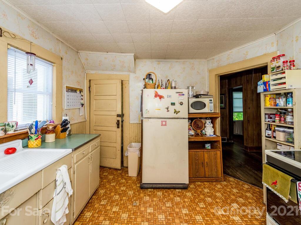 131 Frisby Road Marshall, NC 28753 - Photo 20 of 32 a kitchen with refrigerator and window