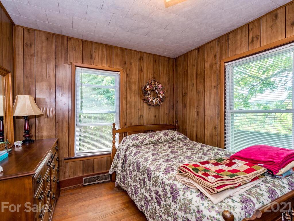 131 Frisby Road Marshall, NC 28753 - Photo 23 of 32 a bedroom with a bed and a window