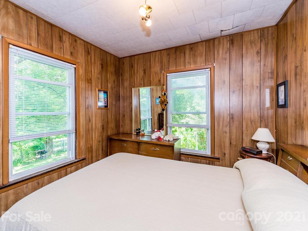 131 Frisby Road Marshall, NC 28753 - Photo 24 of 32 a bedroom with a bed and large window