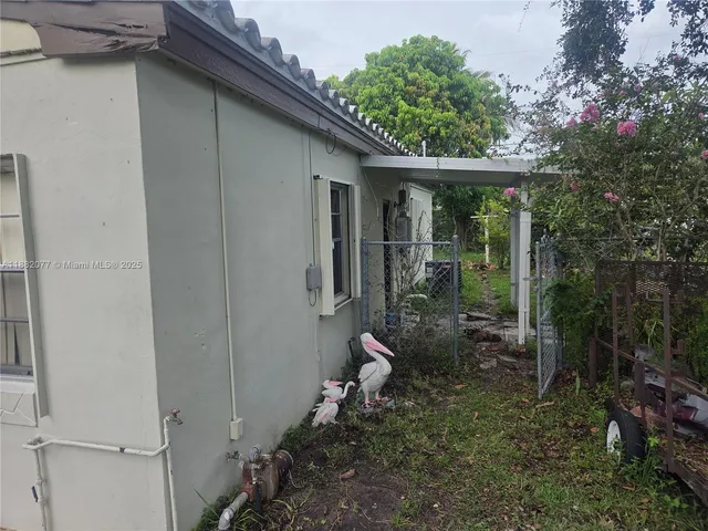 a view of a backyard with garden