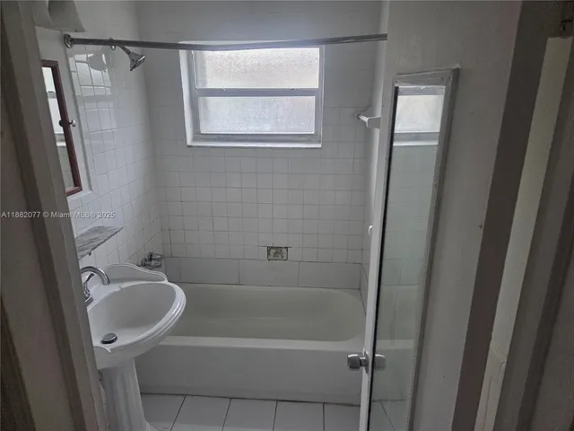 a bathroom with a shower and a toilet