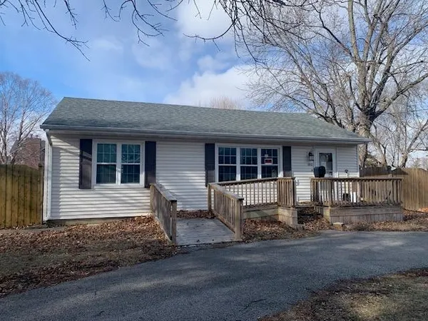 a front view of a house with yard