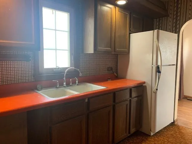 a kitchen with a sink and cabinets