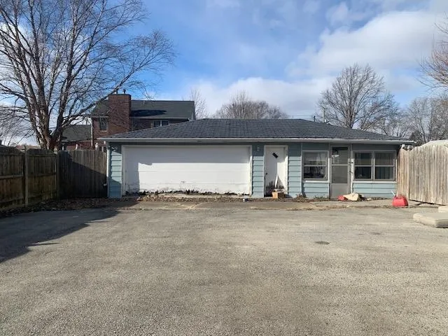 a view of a house with a outdoor space and porch