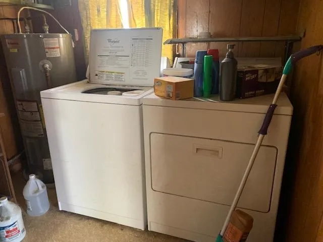 a white toilet sitting next to a bathroom sink and a vanity