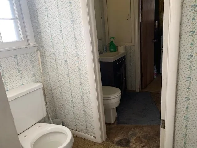 a bathroom with a sink a toilet and bathtub