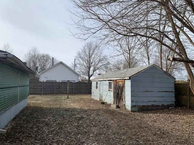 a view of a house with a yard and garage