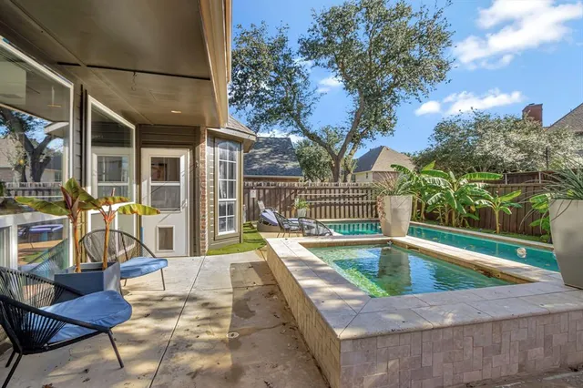 a view of a swimming pool with a lounge chairs