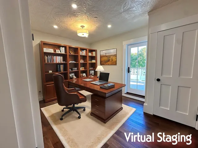 a view of a workspace with furniture and a bookshelf