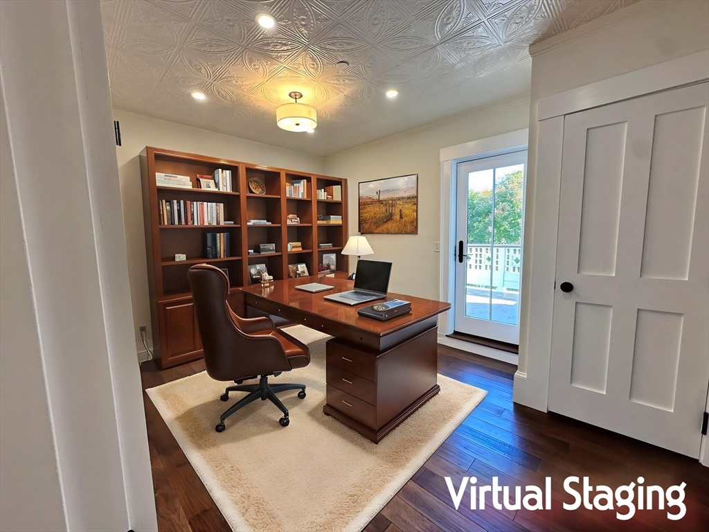 11 Lowell Road, Unit 2B Groton, MA 01450 - Photo 12 of 19 a view of a workspace with furniture and a bookshelf