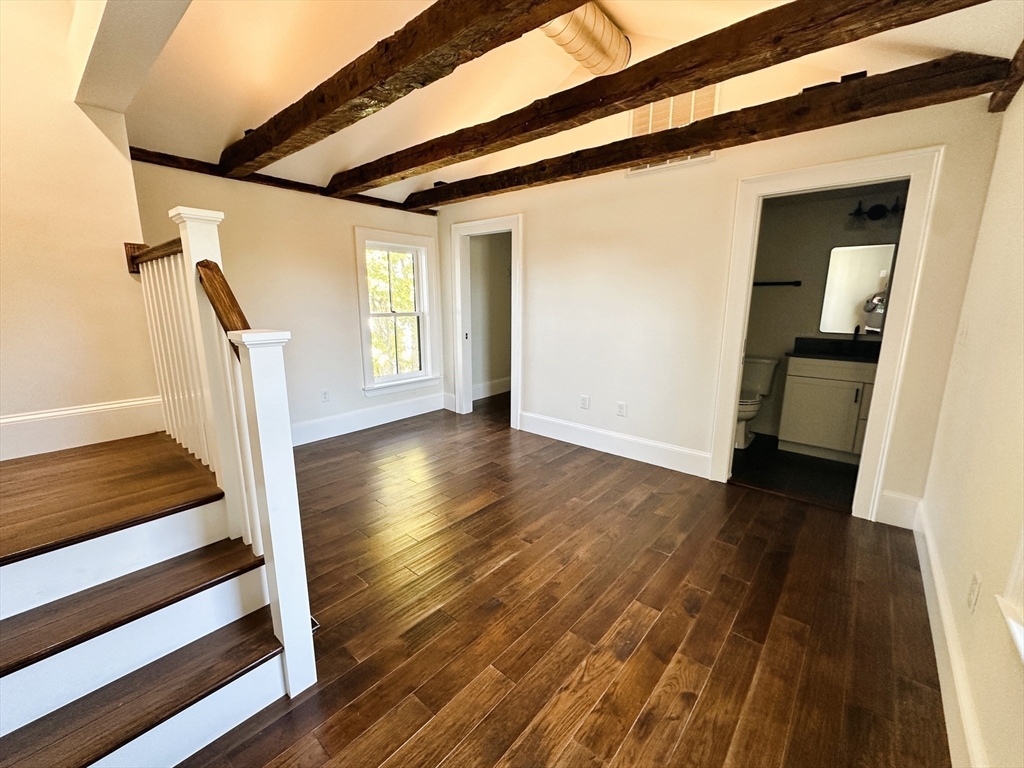 11 Lowell Road, Unit 2B Groton, MA 01450 - Photo 16 of 19 a view of entryway with wooden floor and stairs